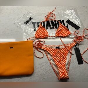 XS top S bottoms never worn triangle swimsuit with tags comes with orange pouch.